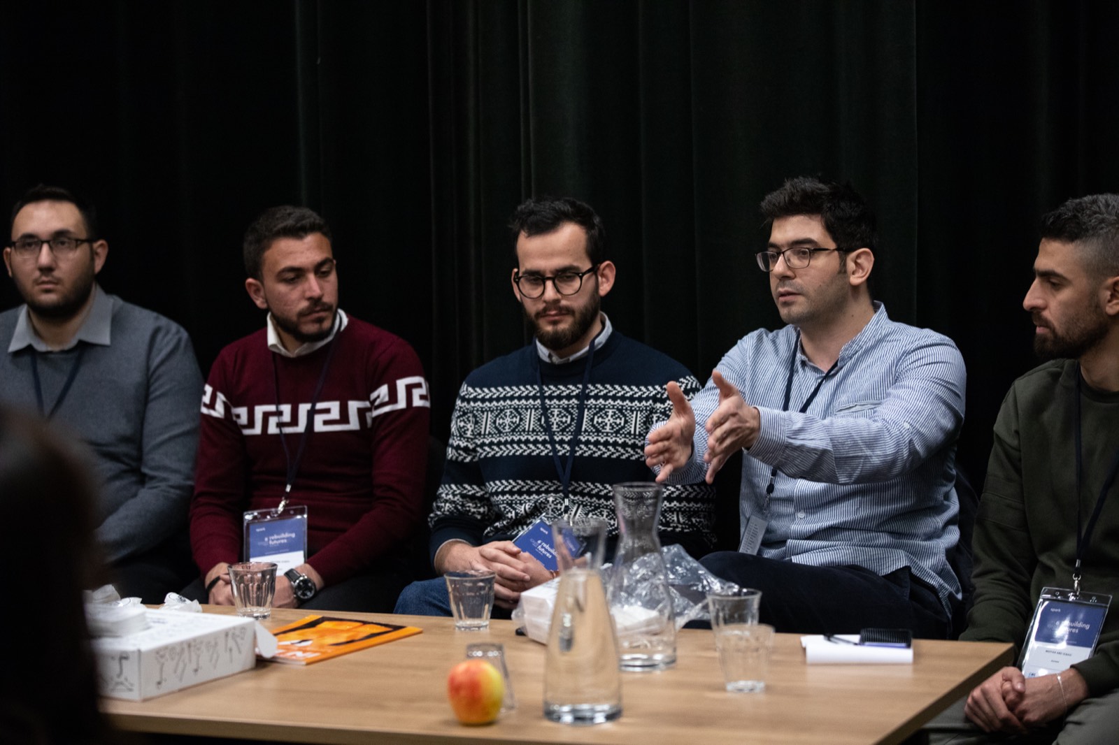 SPARK refugee-entrepreneur panel session — the network the bilingual e-commerce curriculum was designed for